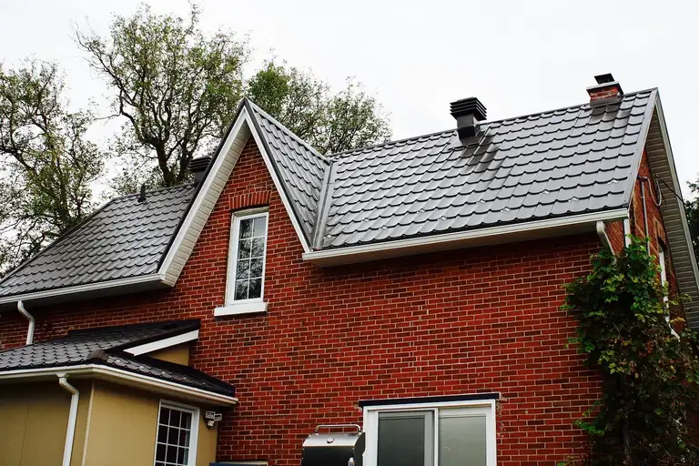 A finished steel tile metal roof on a building near Innisfil